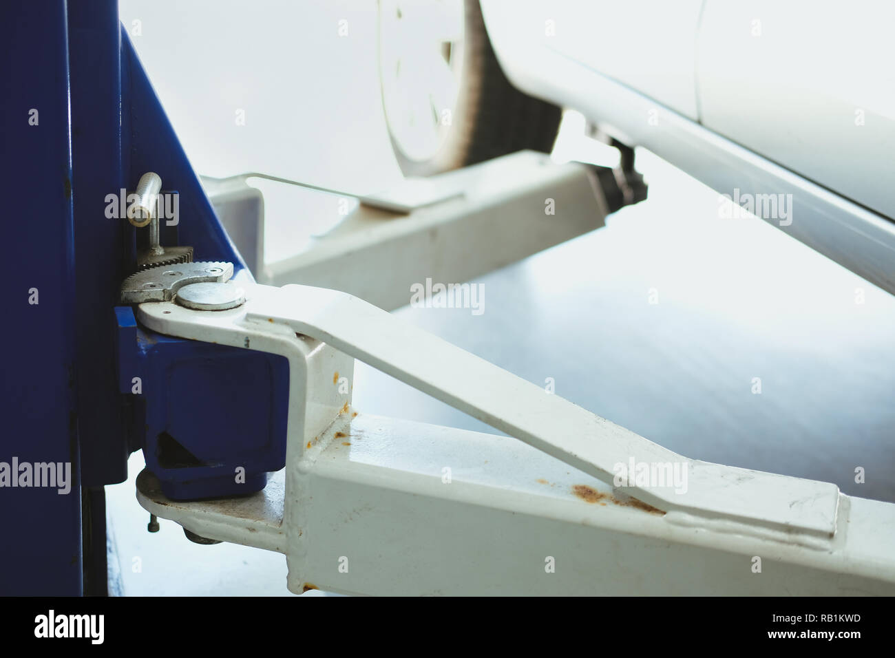 car on lift in automobile service repair garage Stock Photo - Alamy