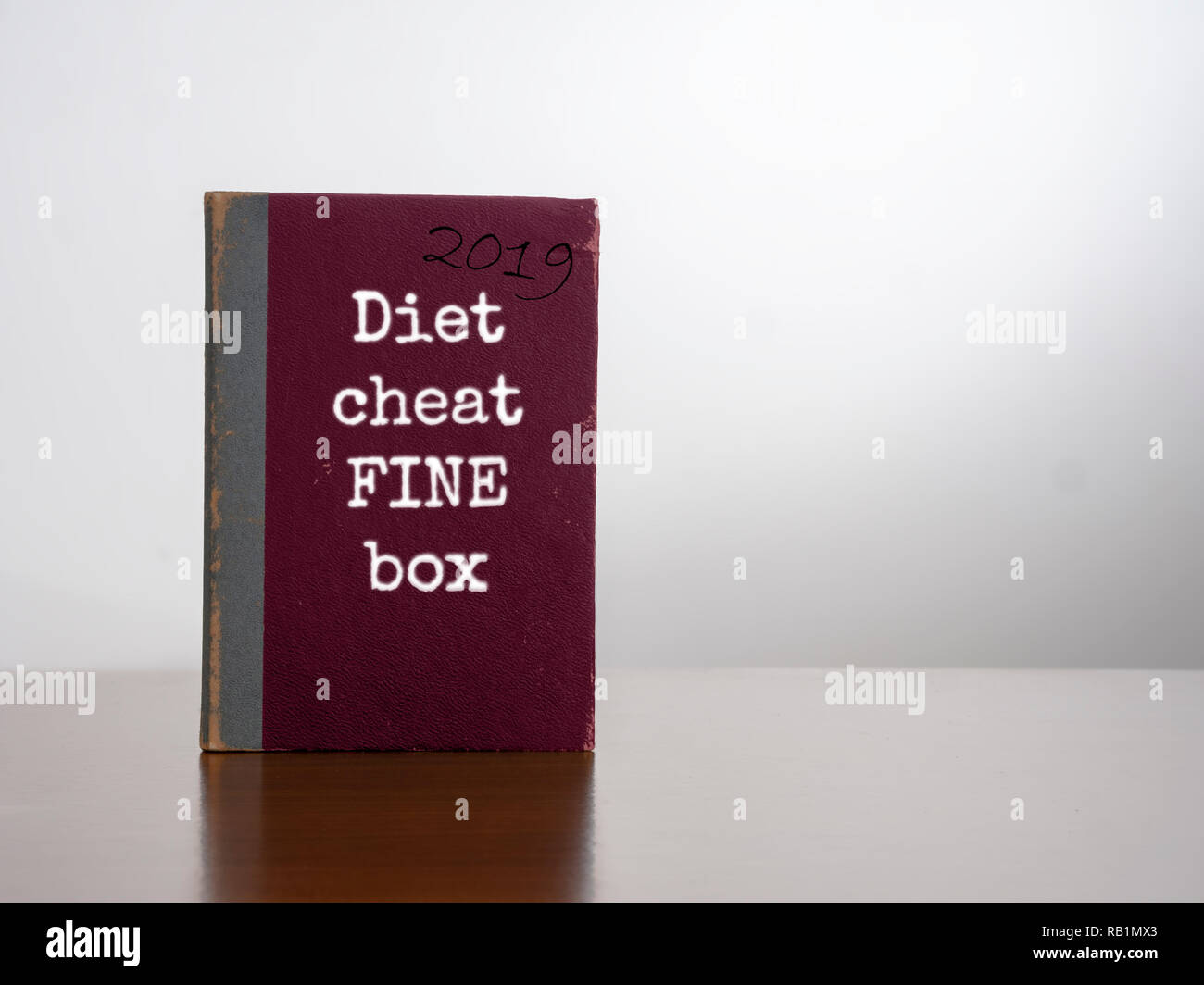 Diet cheat fine box, 2019. On desk. Resolution to lose weight Stock Photo