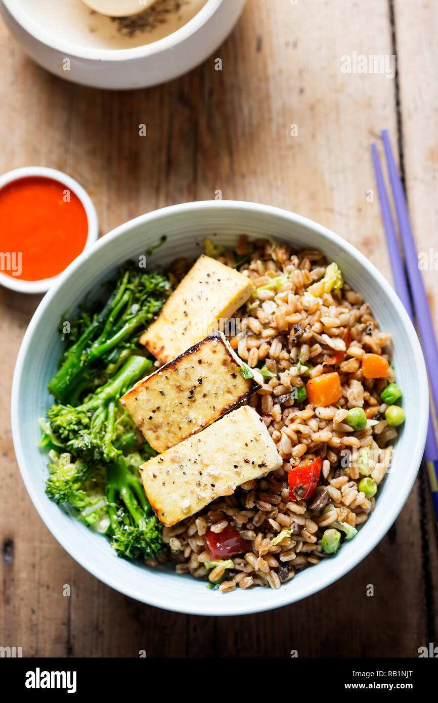 Spelt, broccoli, savoy cabbage with chargrilled tofu with sriracha