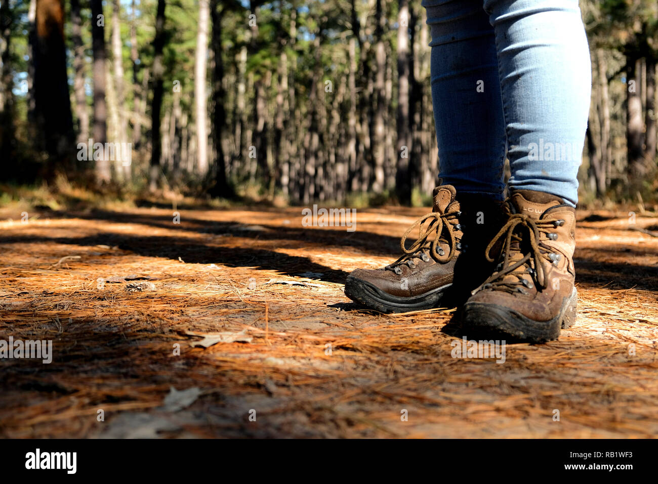 legs wearing jeans and hiking boots 
