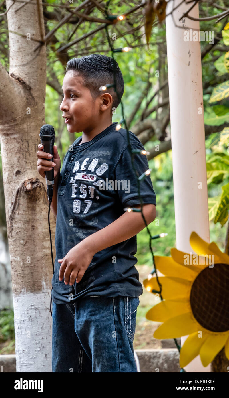 latin child with microphone at party in Guatemala Stock Photo Alamy