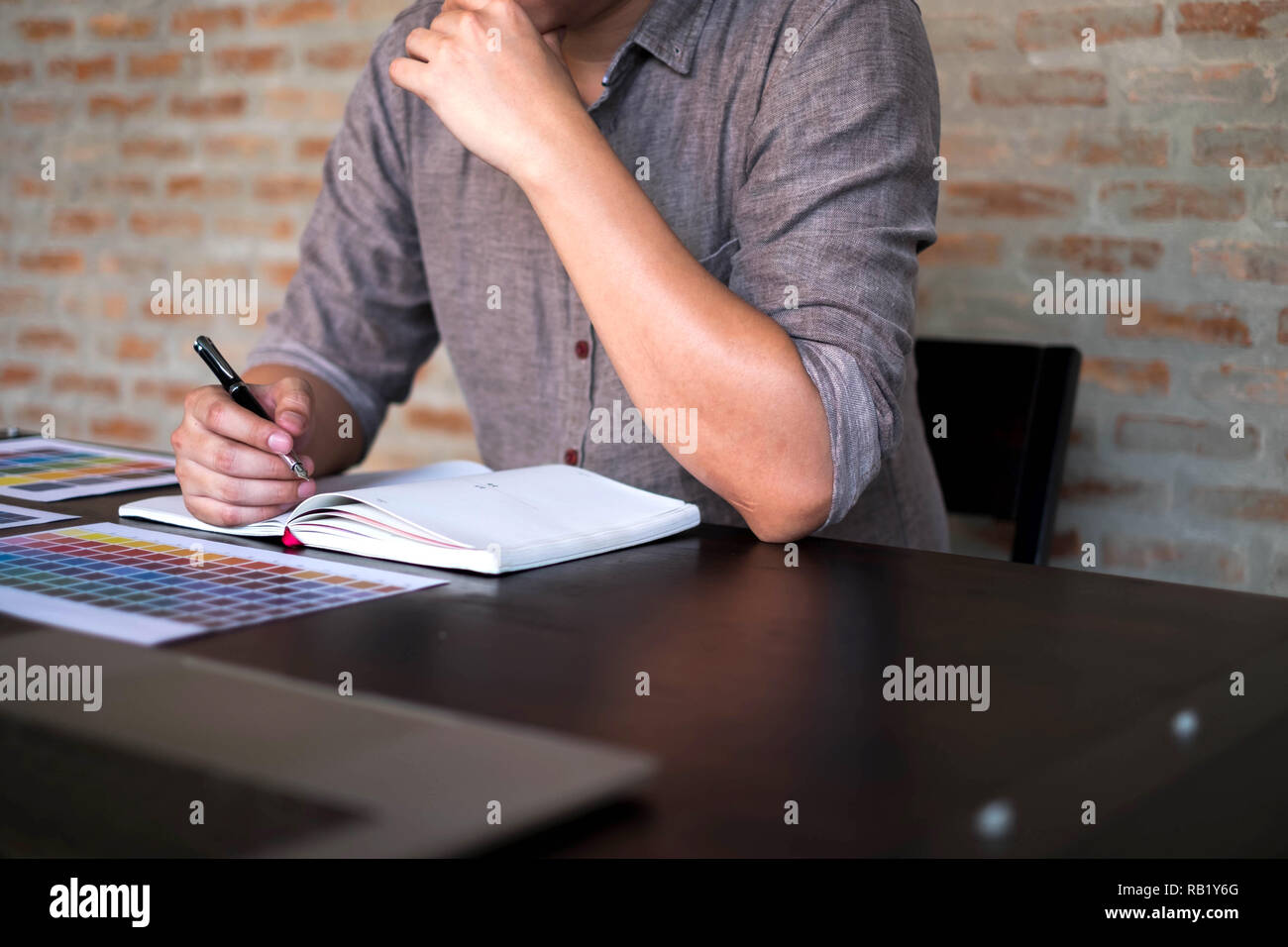 Graphic designers choose colors from the color bands samples for design