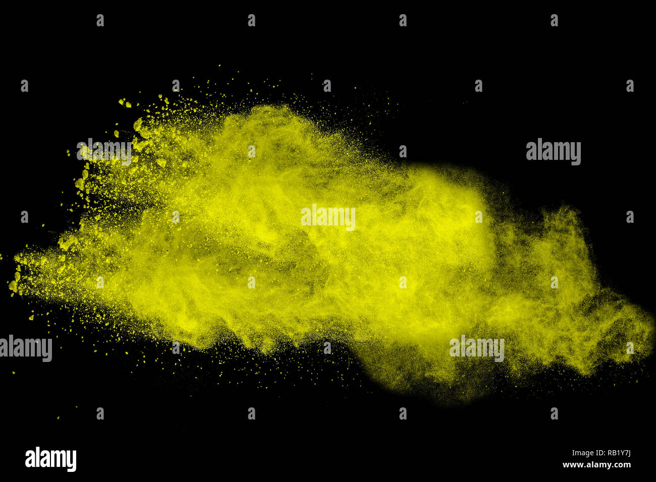 abstract yellow dust explosion on black background. abstract yellow