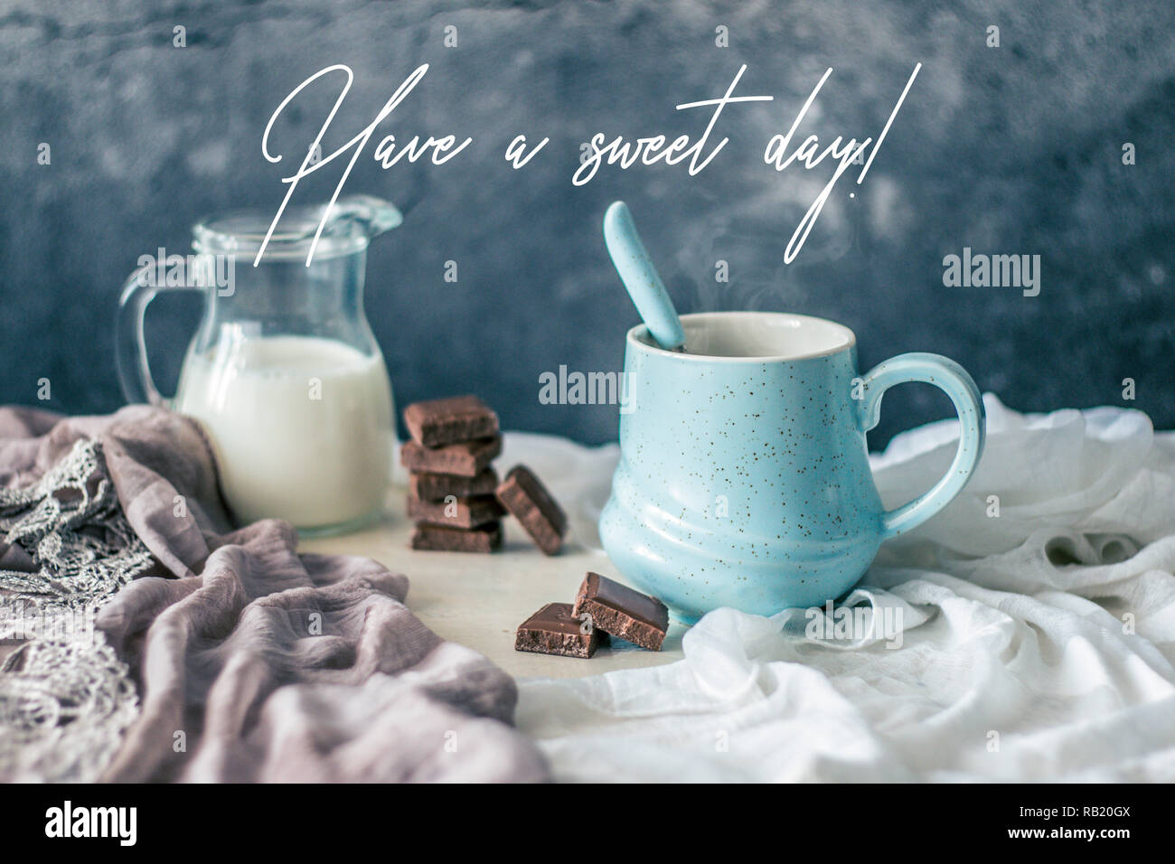 Hot Coffee In A Beautiful Pastel Mug With Chocolate And Fresh Milk With Quote Have A Sweet Day Stock Photo Alamy