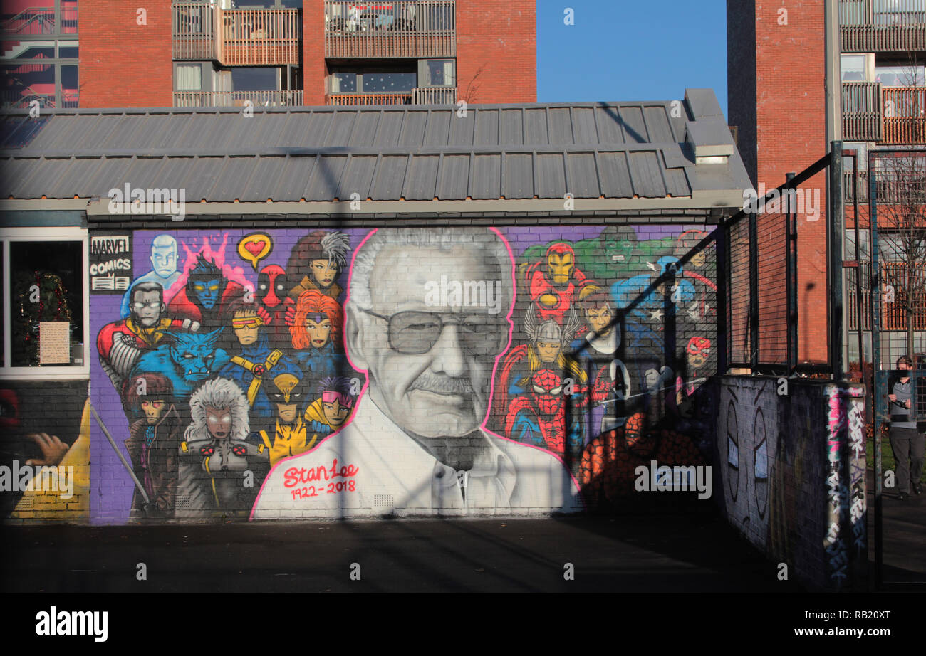 This magnificent image has appeared on a wall that is part of a community centre in Glasgow. It is the artist, EJEK's tribute to the great comic book, and superhero creator, Stan Lee, who died in 2018. Here, he is surrounded by many of the superheroes that he created. The image is at the Barn community centre in the Gorbals area of Glasgow. Alan Wylie/ALAMY © Stock Photo