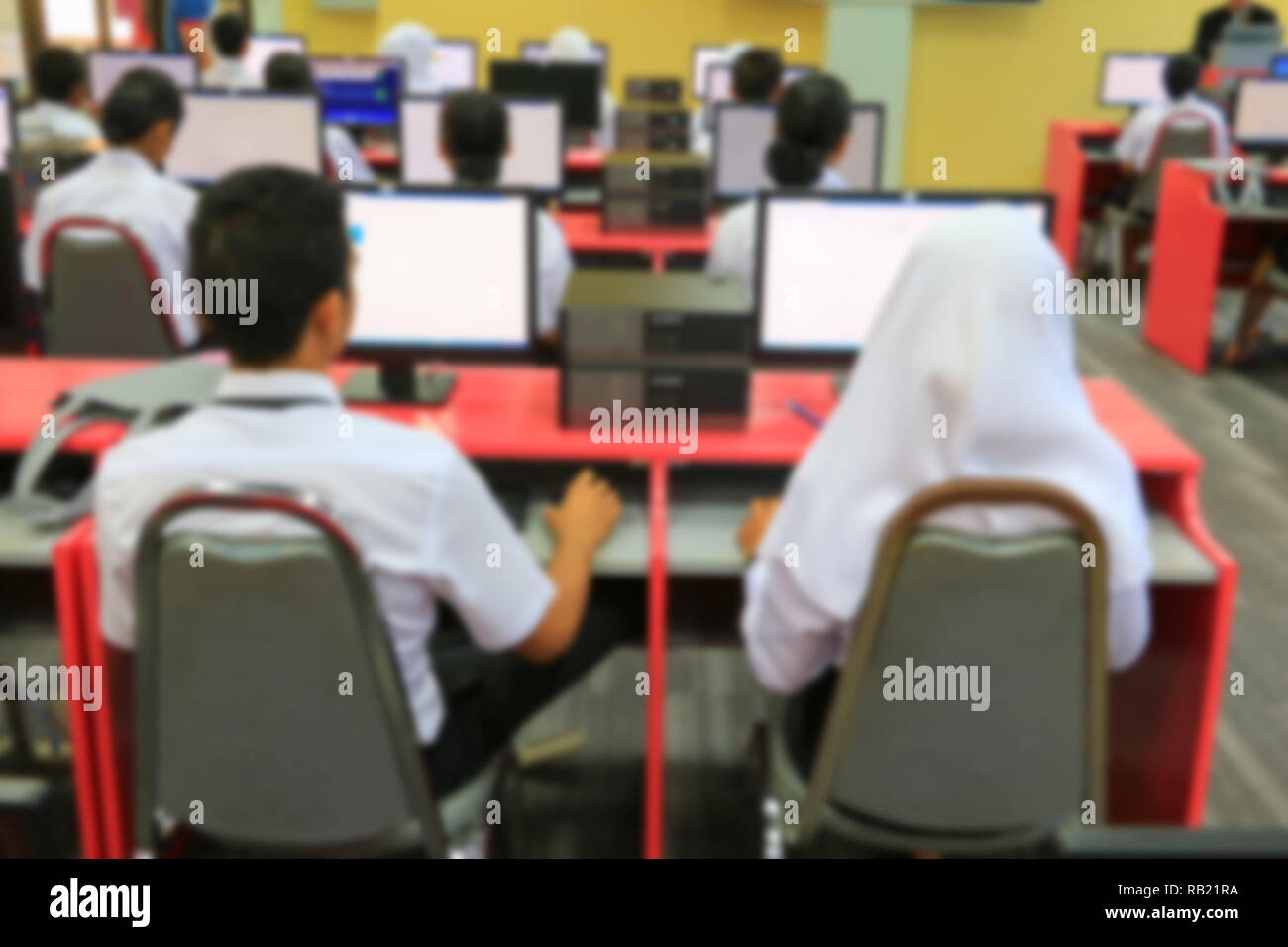 focus blur, the student with teacher learning business technology desktop computer in a classroom Stock Photo