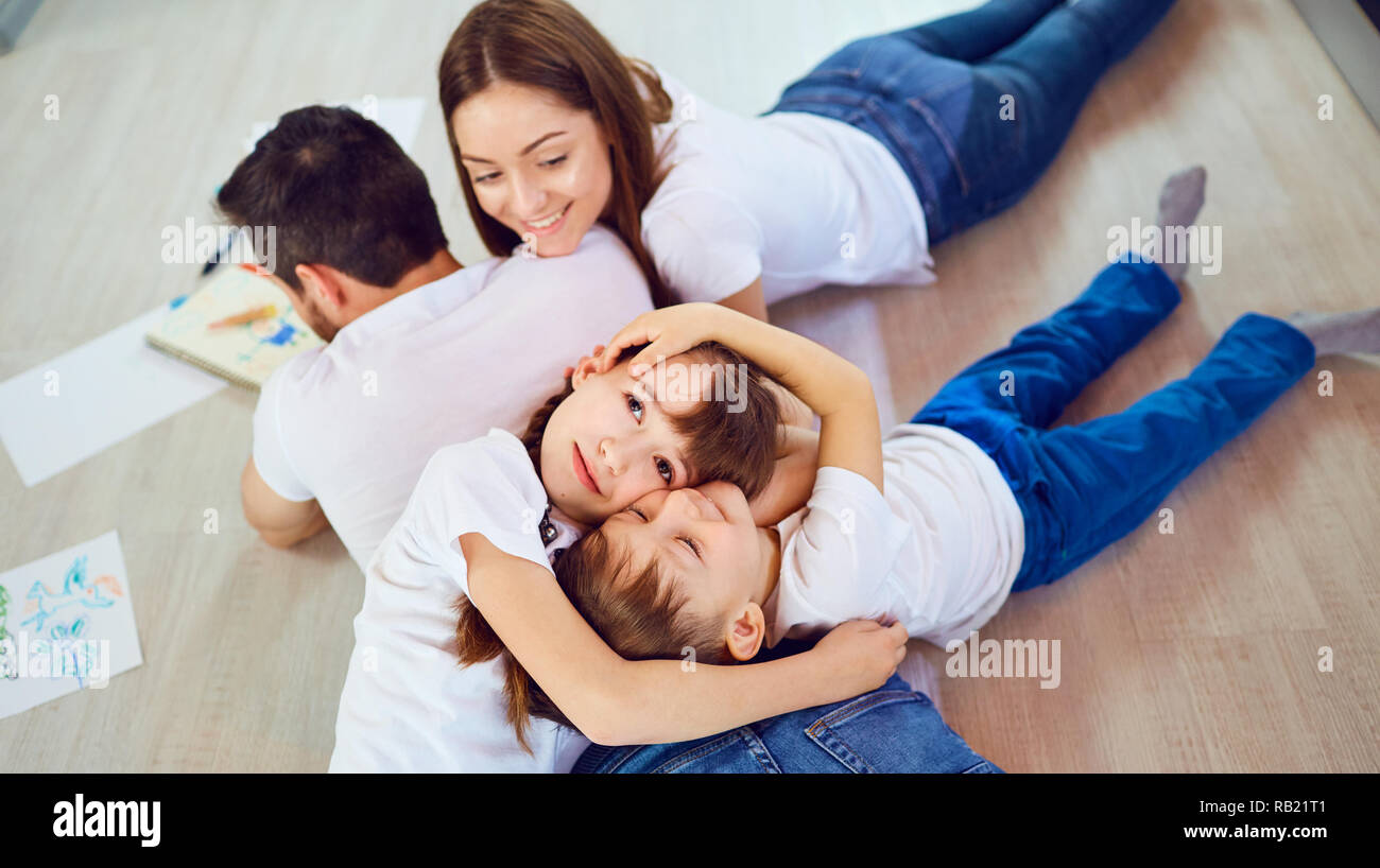 Top view of a happy family playing on the floor Stock Photo