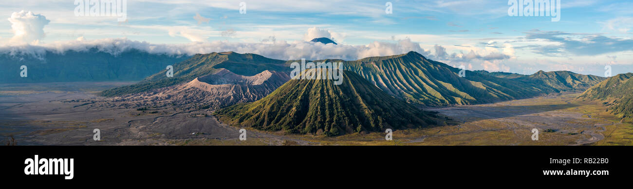 Bromo mountain , day time with dramatic cloud on blue sky, panorama. Stock Photo