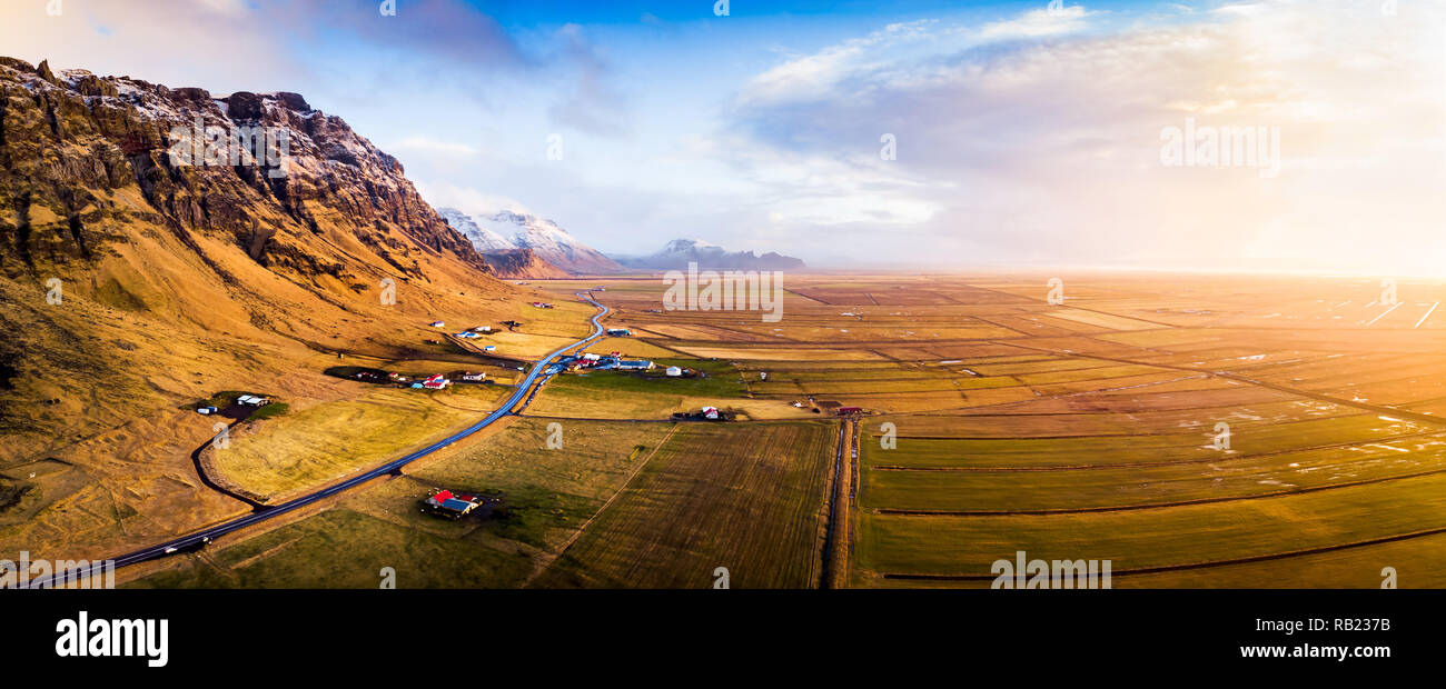 Village and scenic road in Iceland aerial panoramic view at sunset Stock Photo