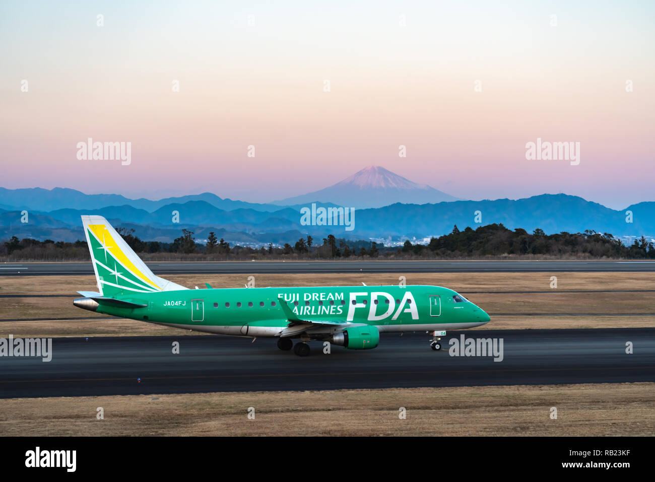 SHIZUOKA, JAPAN - JAN. 5, 2019: FDA (Fuji Dream Airlines) Embraer ERJ-170-100 taxing at the Shizuoka International Airport in Shizuoka, Japan at dusk. Stock Photo
