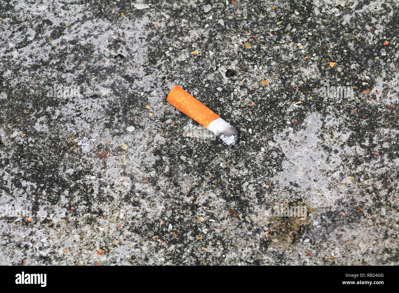 cigarette butt. on the cement floor Smoking bad for health. concept Non