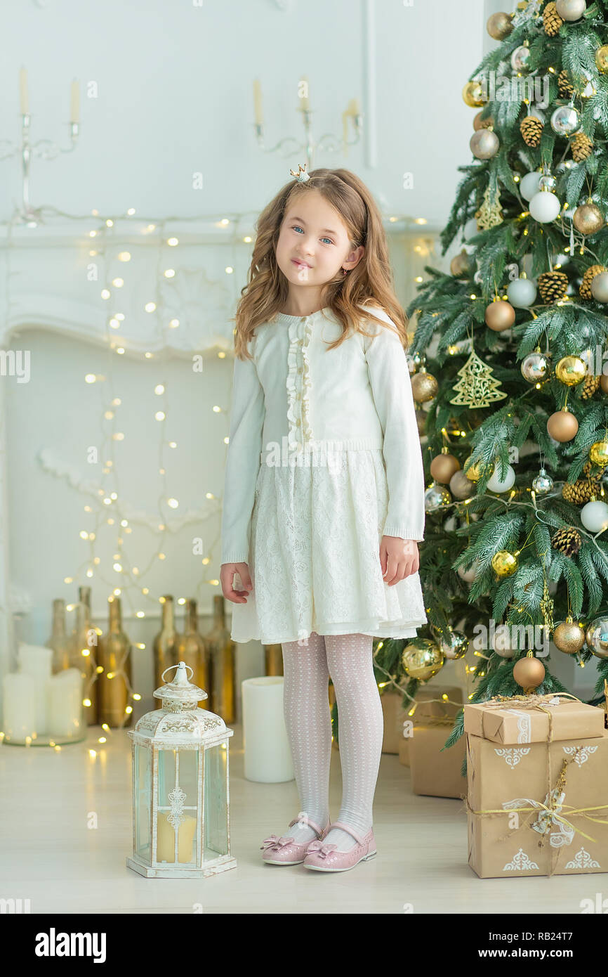 Family on Christmas eve at fireplace. Kids opening Xmas presents Christmas Eve Traditiona