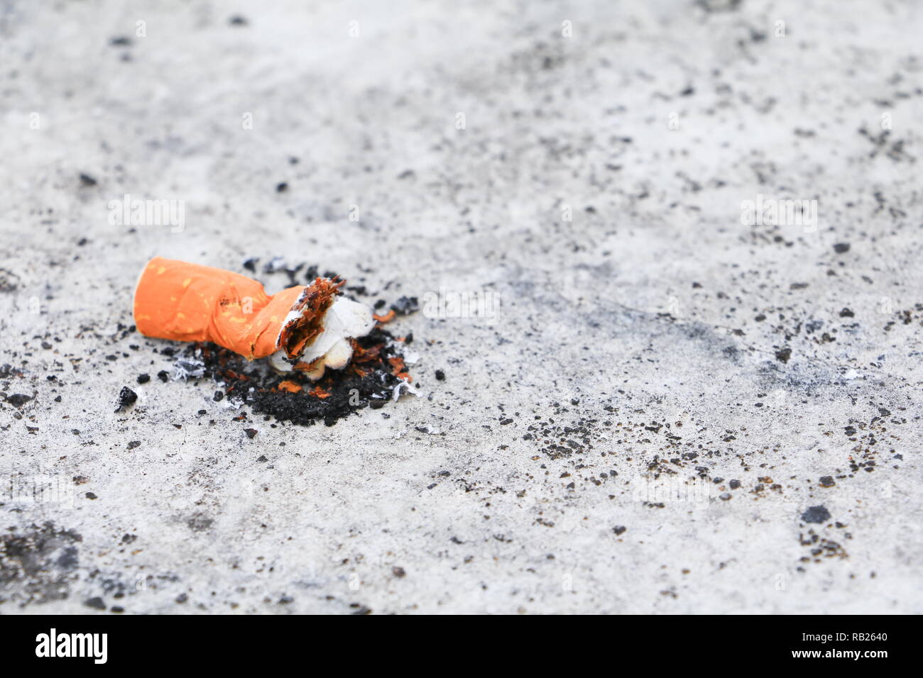 cigarette butt. on the cement floor Smoking bad for health. concept Non