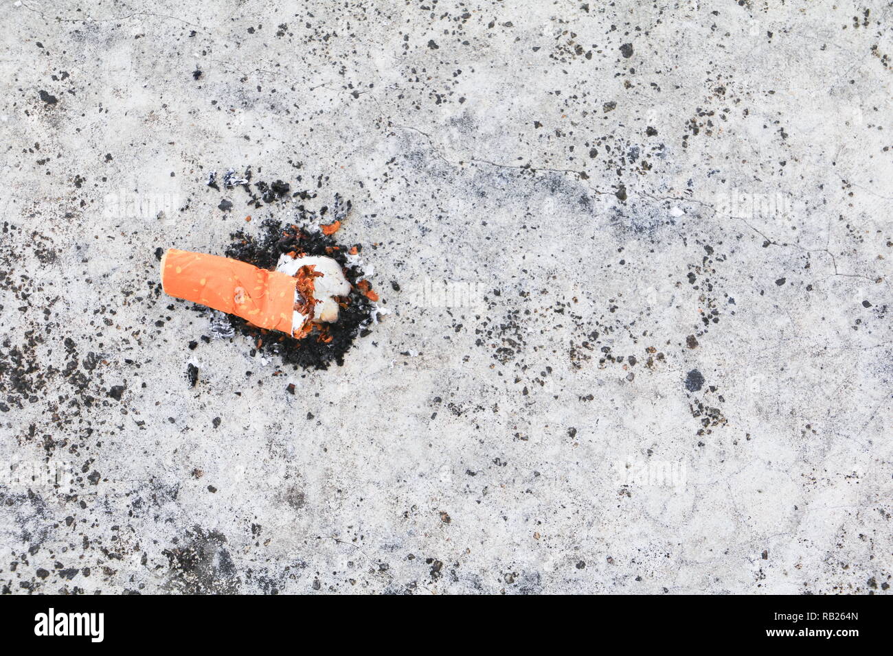 cigarette butt. on the cement floor Smoking bad for health. concept Non