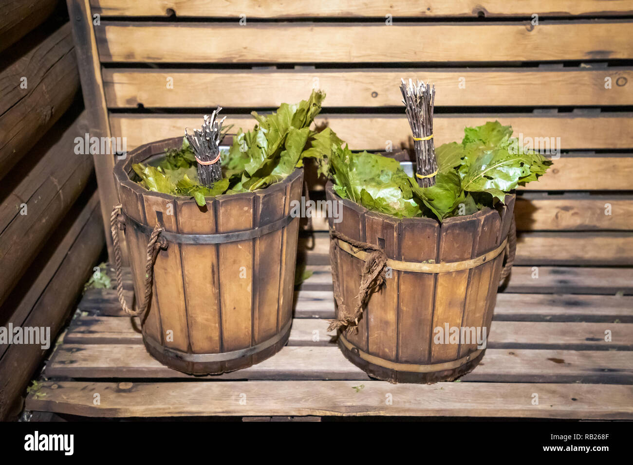 Birch broom in a wooden bucket in the bathhouse Stock Photo ...