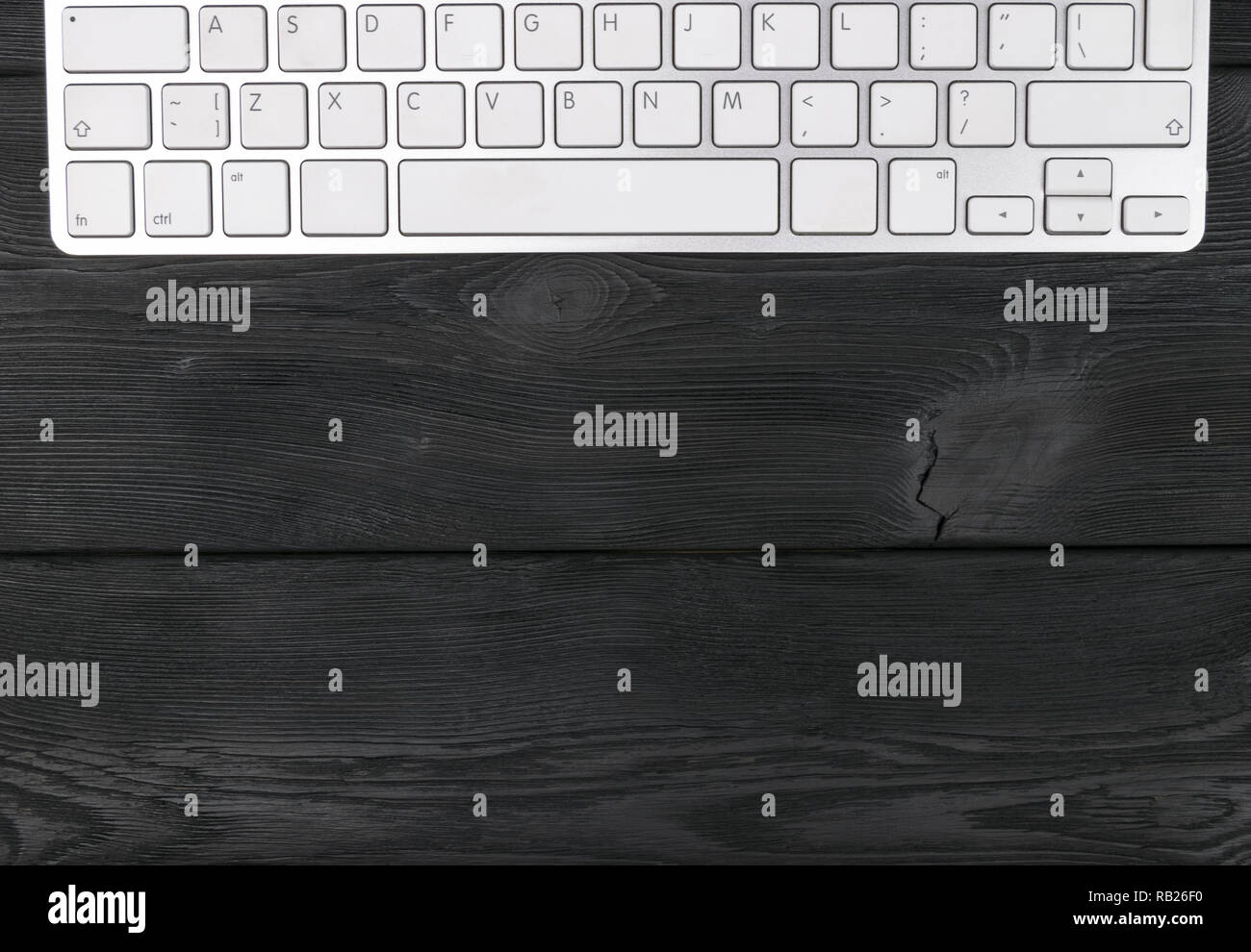 Close up view of a workplace with wireless computer keyboard, keys on ...