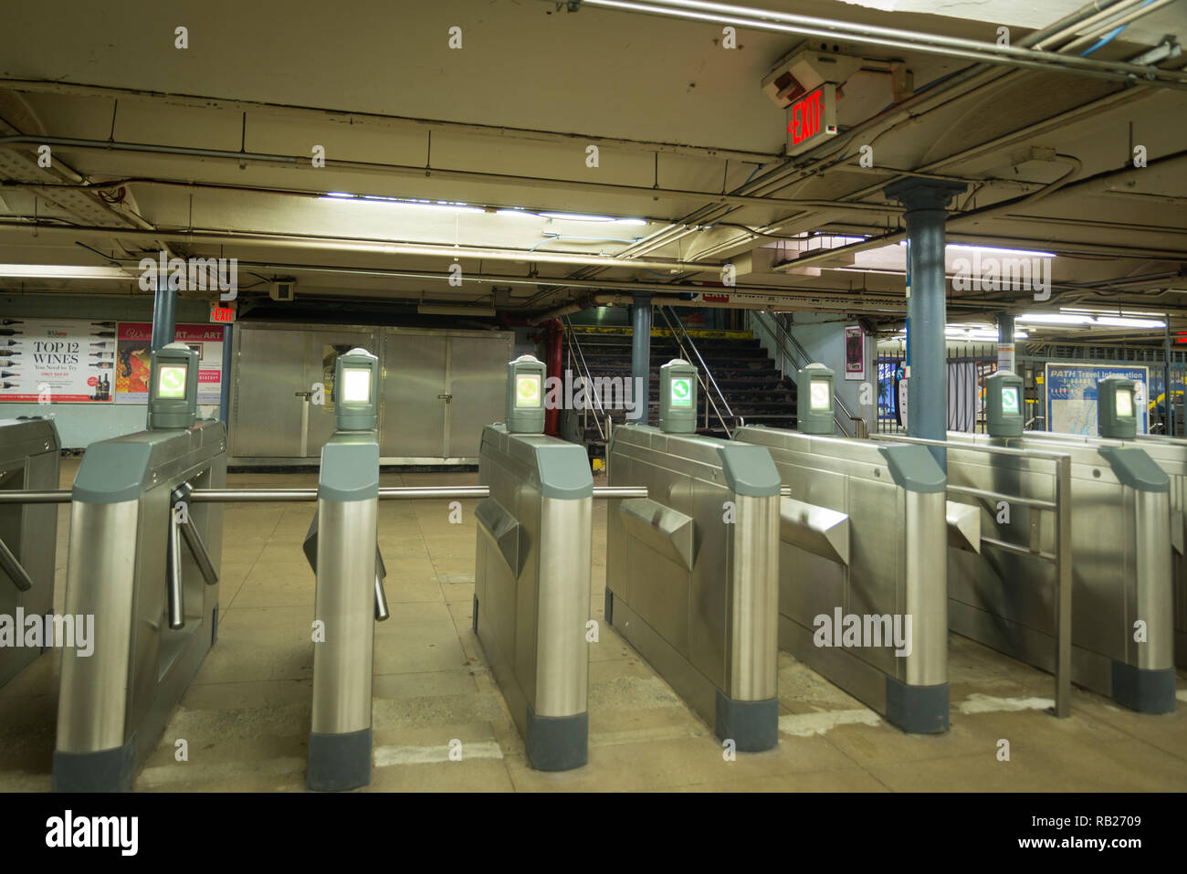 Turnstiles with no people walking in the station showing commute. th Station run by Port Authority runs trains Stock Photo