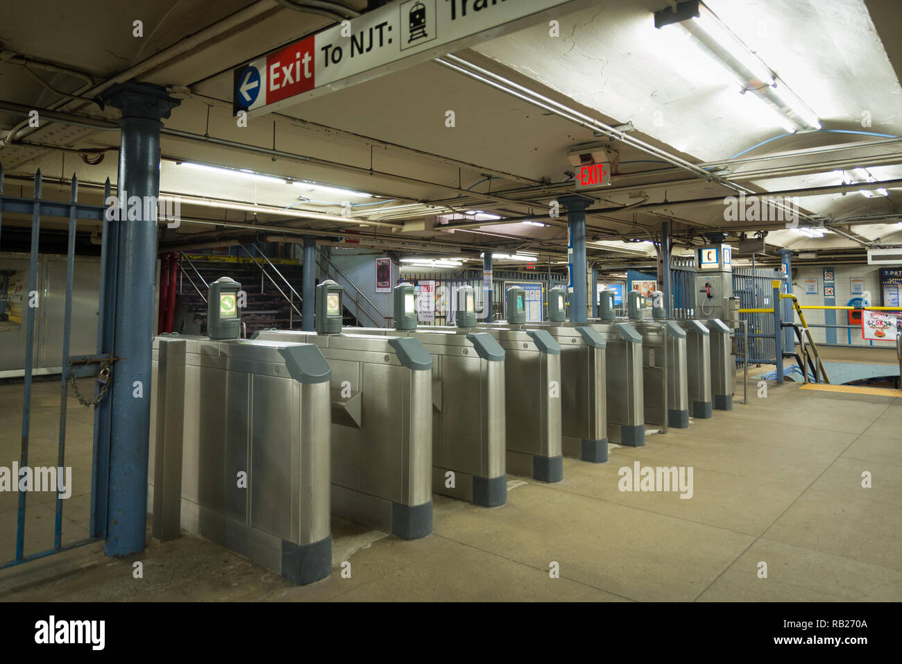 Turnstiles with no people walking in the station showing commute. th Station run by Port Authority runs trains Stock Photo