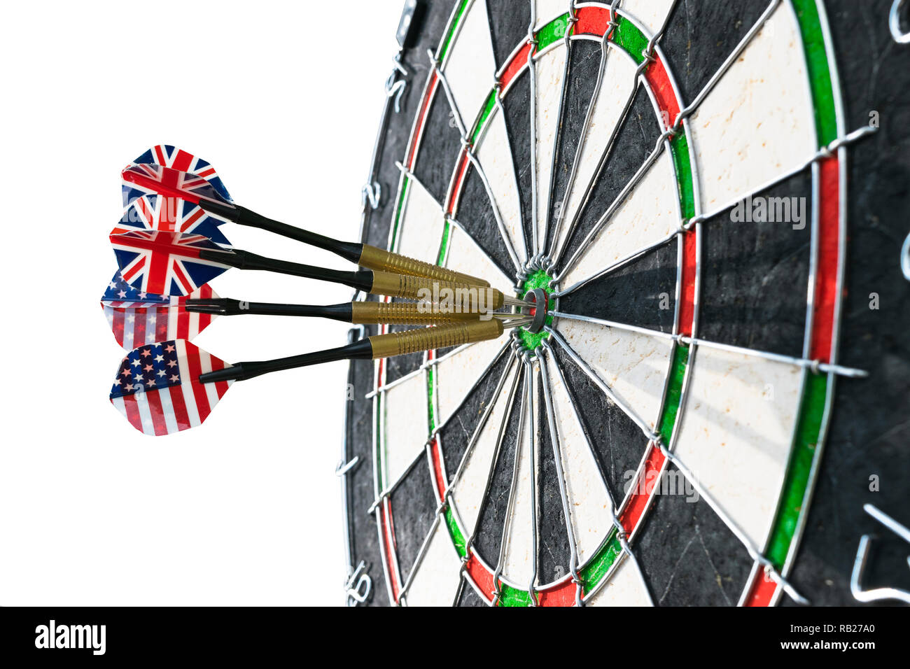 Metal darts have hit the red bullseye on a dart board. Darts Game. Darts  arrow in the target center darts in bull's eye close up. isolated on white  ba Stock Photo -