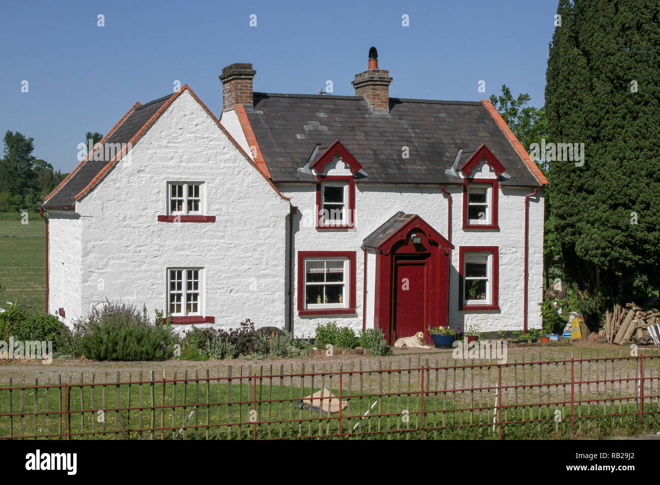 Two story canal lock house. The whitewashed lock keepers house is on