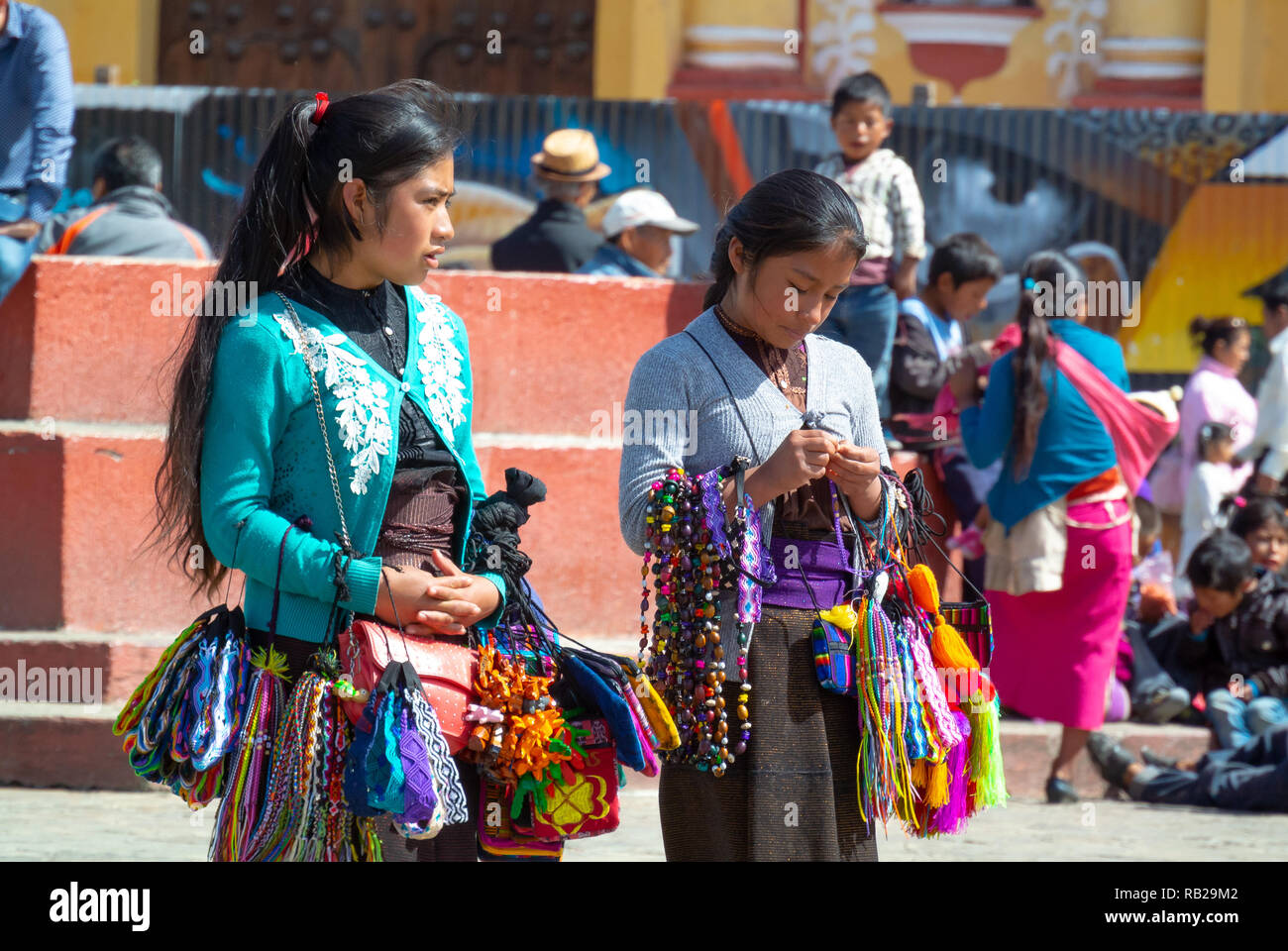 indigenous girls selling souvenirs in a street, San Cristobal de las Casas, Chiapas, Mexico Stock Photo