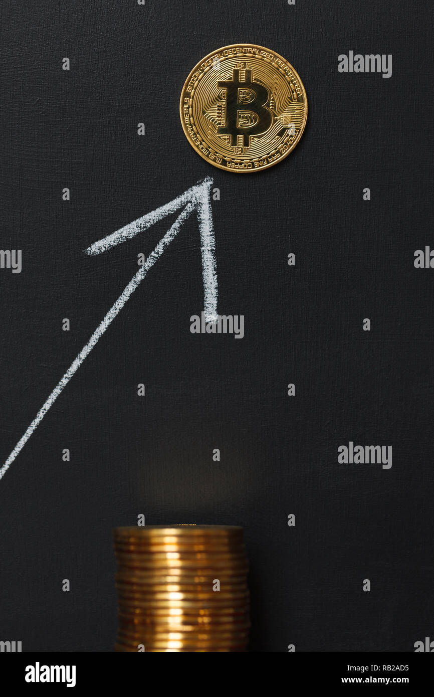 White arrow Bitcoin grow up on the blackboard Stock Photo