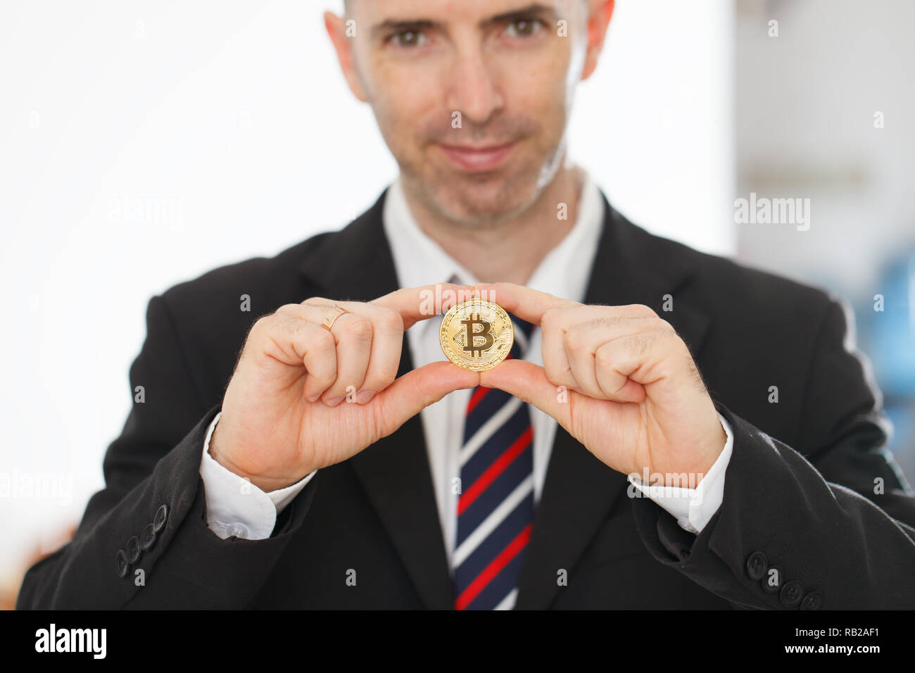 Bitcoin in the both hands Stock Photo