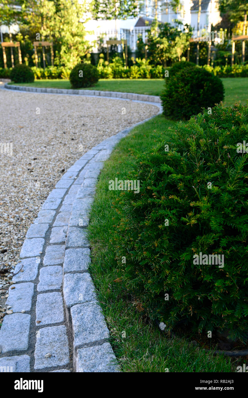 stone edging,edged,edged,lawn,laws,grass,yew ball,balls,garden design,feature,hard landscaping,serpentine,lead,leading,leads the eye,RM Floral Stock Photo