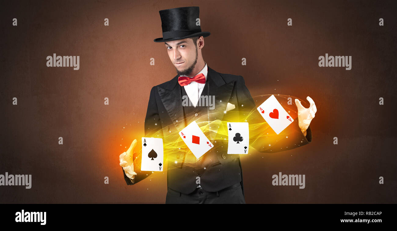 Illusionist in tails bandy play cards between his two hands Stock Photo ...
