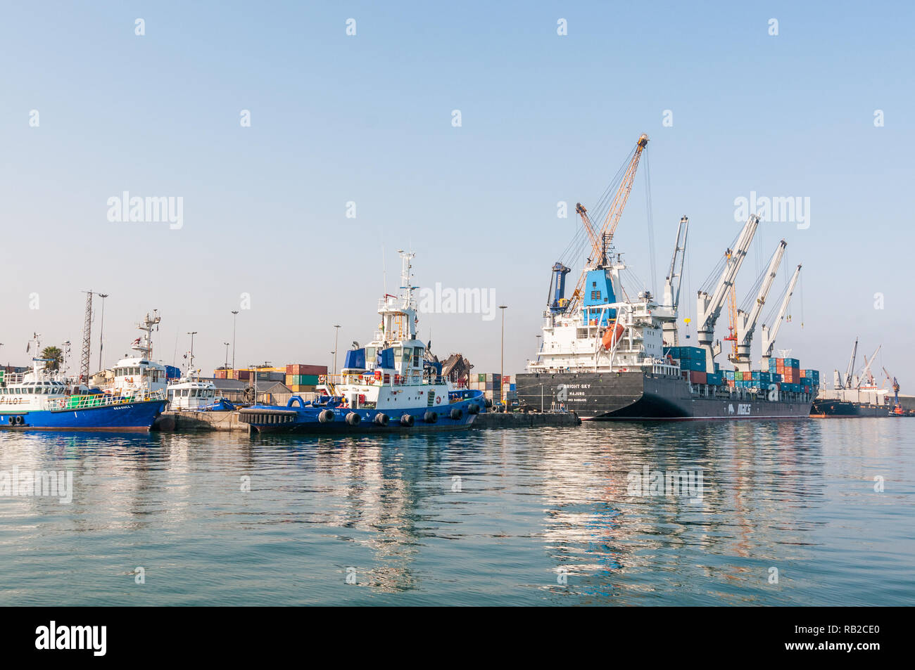 boat with cranes in the harbor, Walvis Bay, Namibia Stock Photo