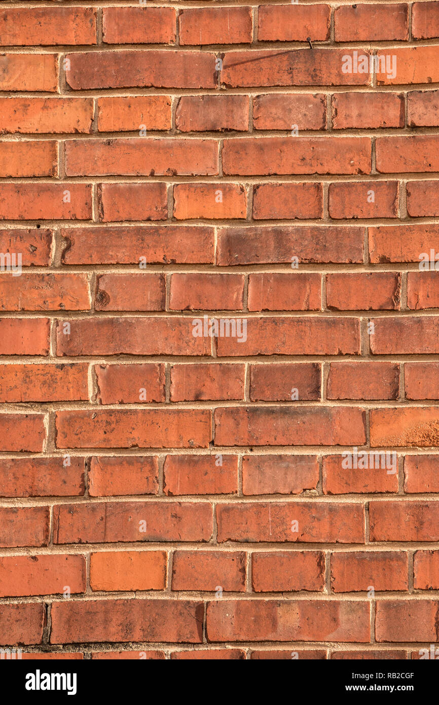 Old empty brick house factory wall with red bricks Stock Photo