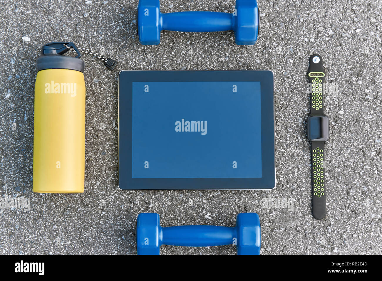 Smart sports gadgets. Cropped photo of dumpbells, water and smart watch