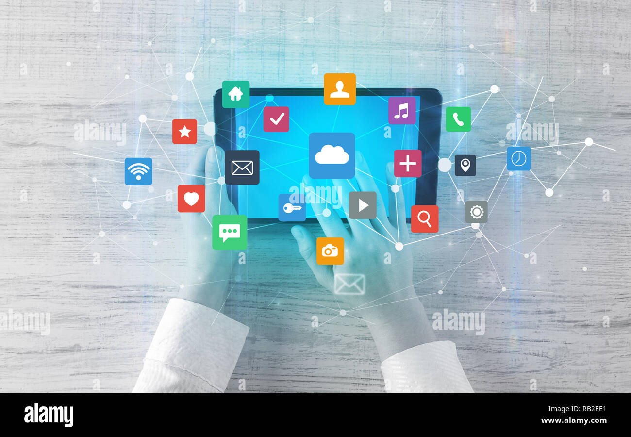 Hand touching multitask tablet with cloud wifi message social media ...