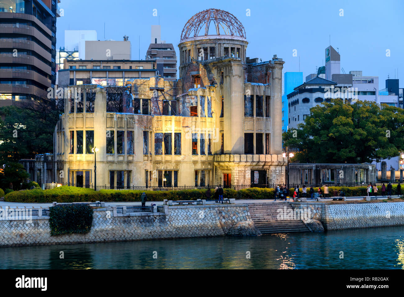 Hiroshima Peace Memorial, the Atomic Bomb Dome, A-Bomb Dome, Genbaku Dome, at early evening with the river reflecting the building and lights. Stock Photo