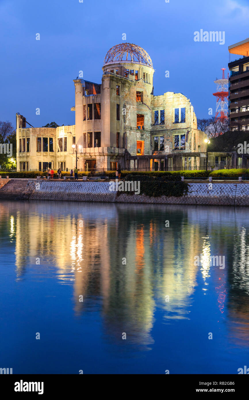 Hiroshima Peace Memorial, the Atomic Bomb Dome, A-Bomb Dome, Genbaku Dome, at night time with the river reflecting the building and lights. Stock Photo