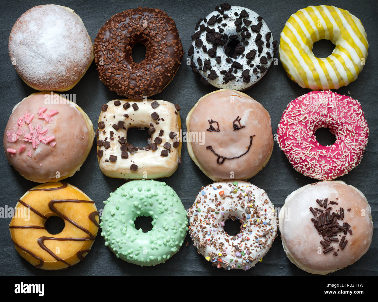 Doughnuts donuts various types of cakes abstract fat thursday concept Stock Photo