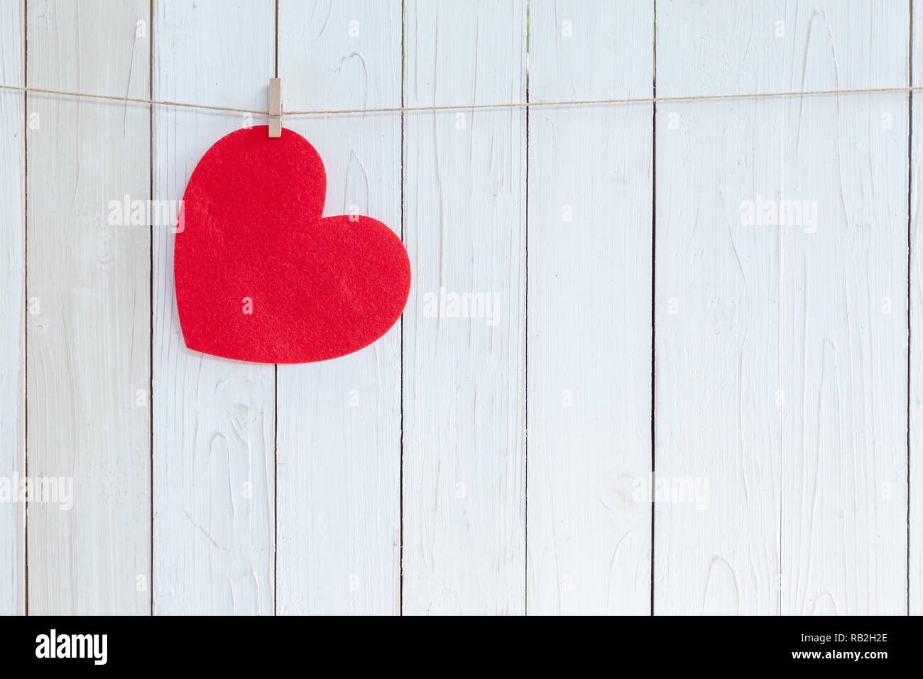 Red heart hanging on white wood background with copy space Stock Photo ...
