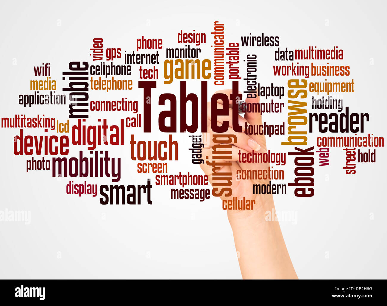 Tablet word cloud and hand with marker concept on white background