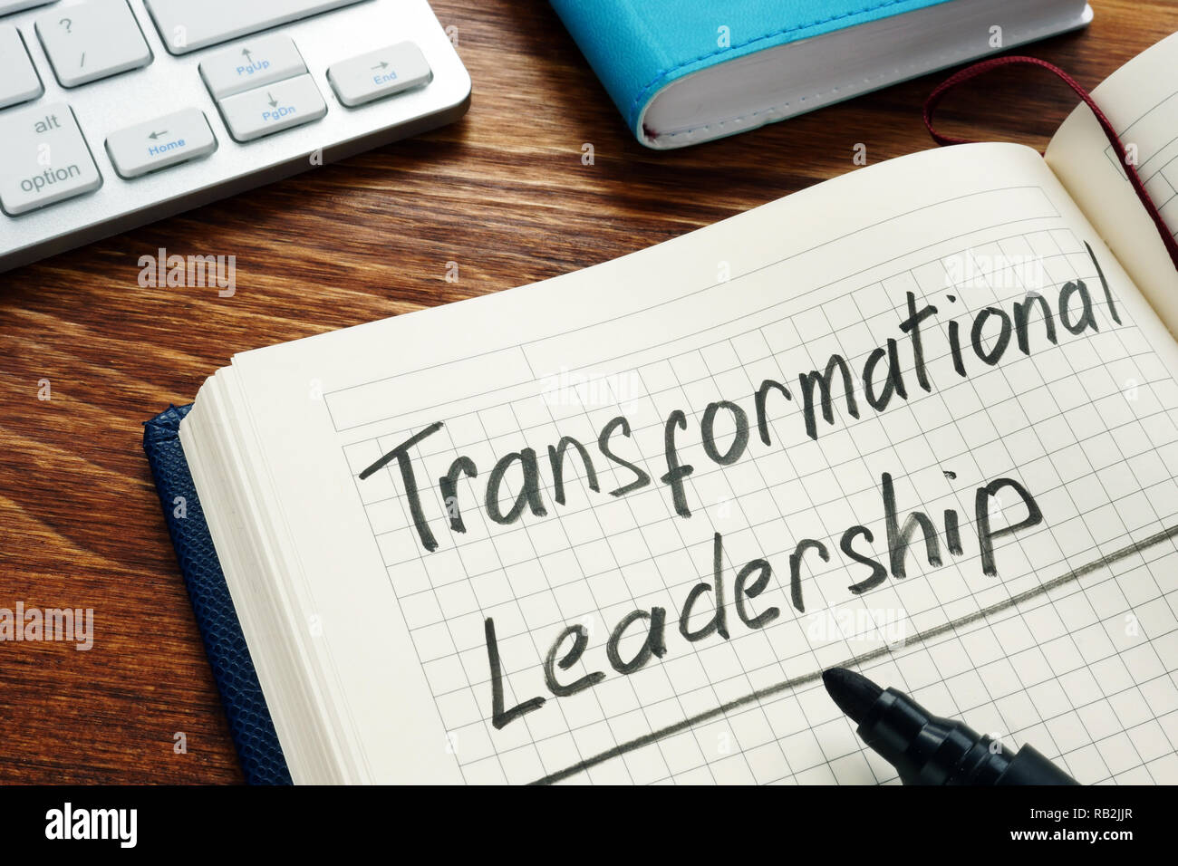 Transformational leadership handwritten in a notepad. Stock Photo