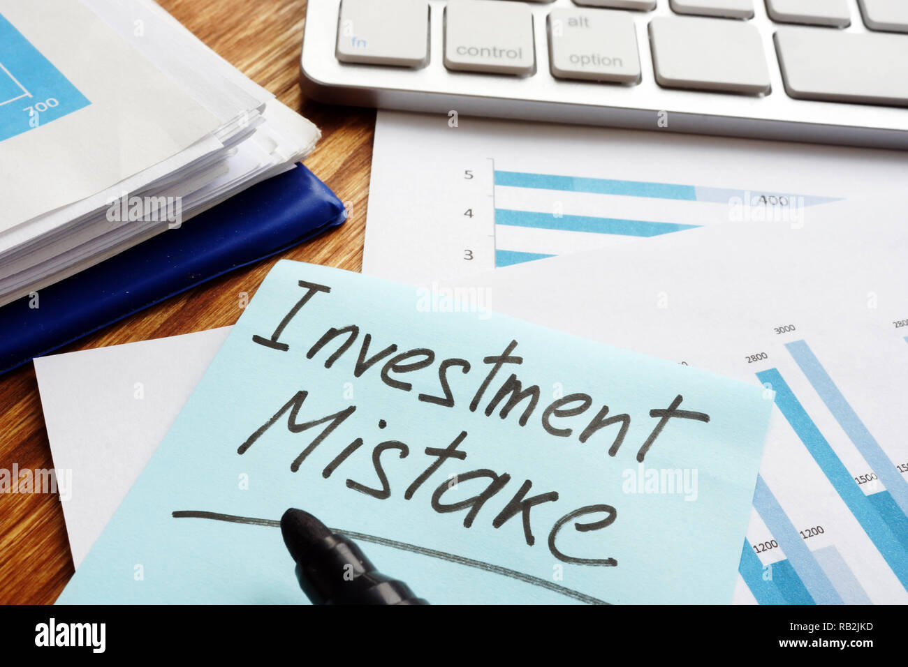 Investment Mistake written on a financial documents. Stock Photo
