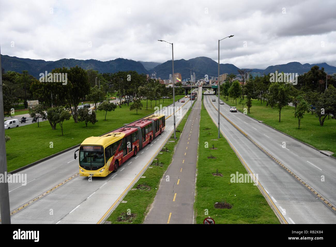 TransMilenio bus in transit, public mass transportation system, in the Andean mountain city of Bogota, Colombia, South America Stock Photo