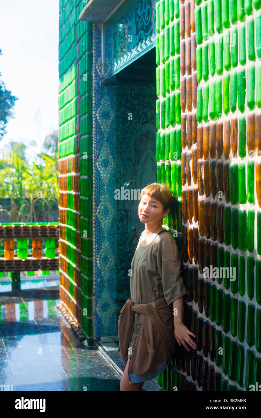 Asian female model poses for pictures in the outdoors Stock Photo