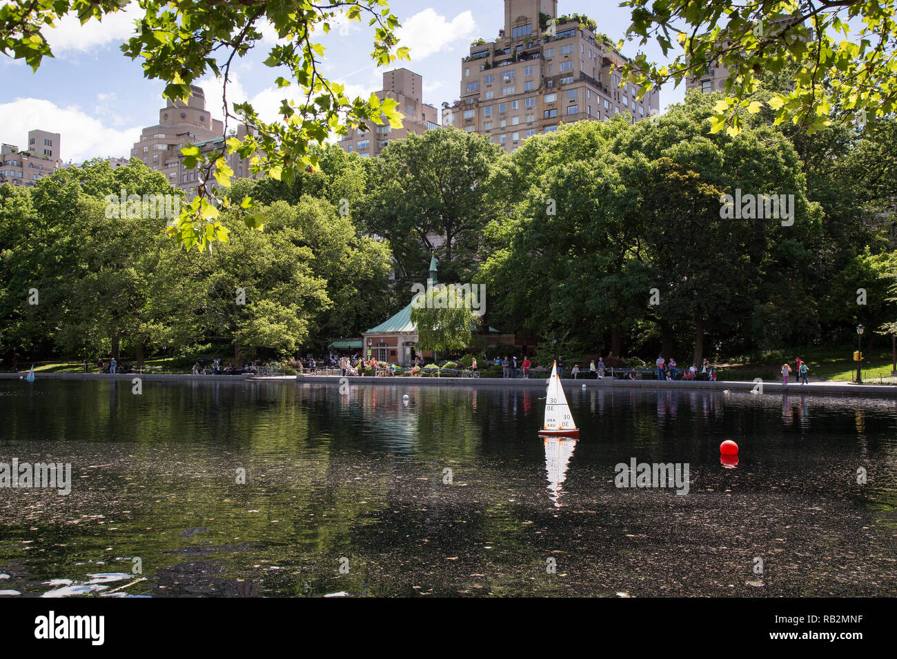 Model sailboat in the Conservatory Water in Central Park, New York. Stock Photo