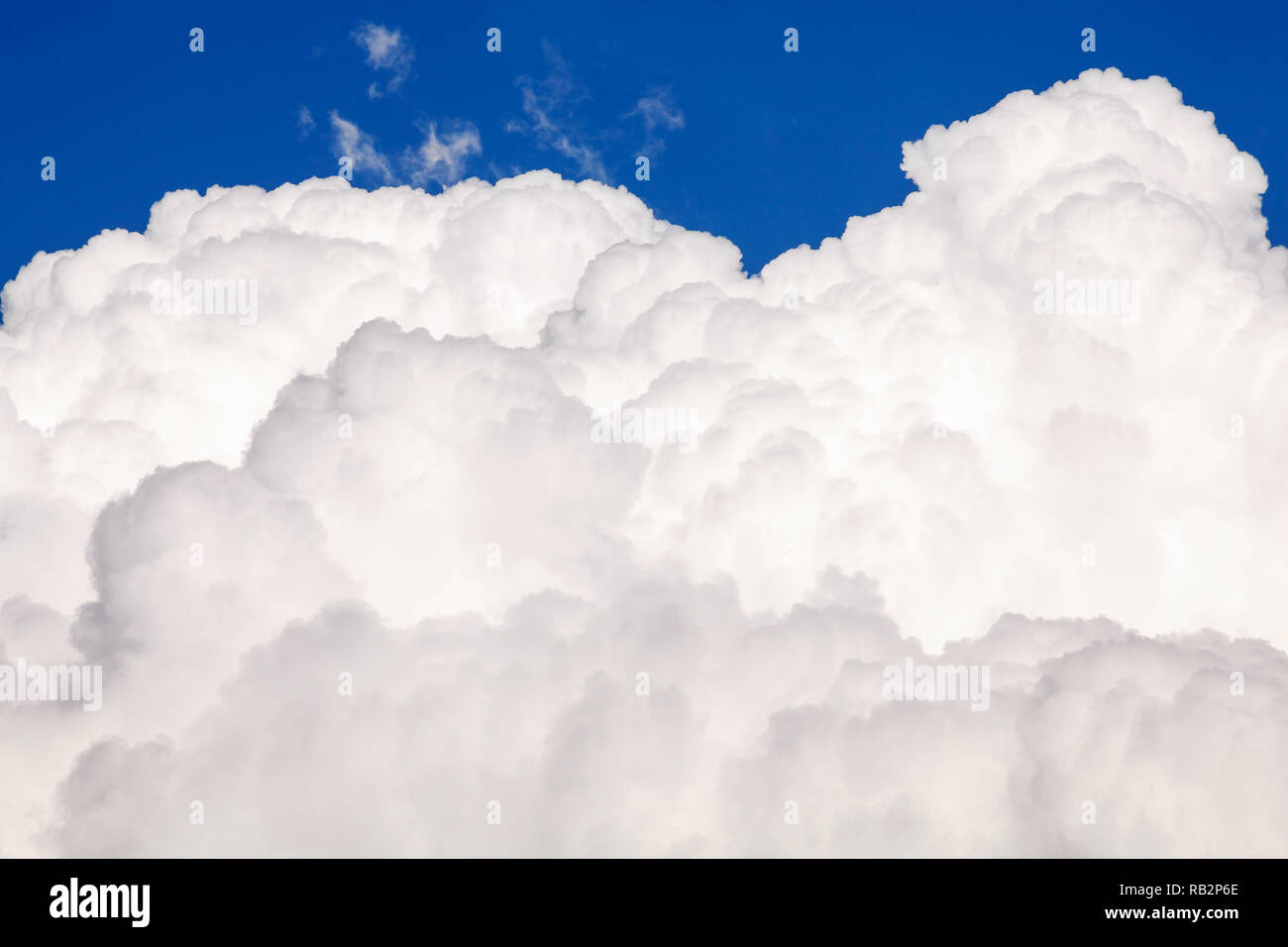 Big white puffy cloud on the blue sky Stock Photo Alamy
