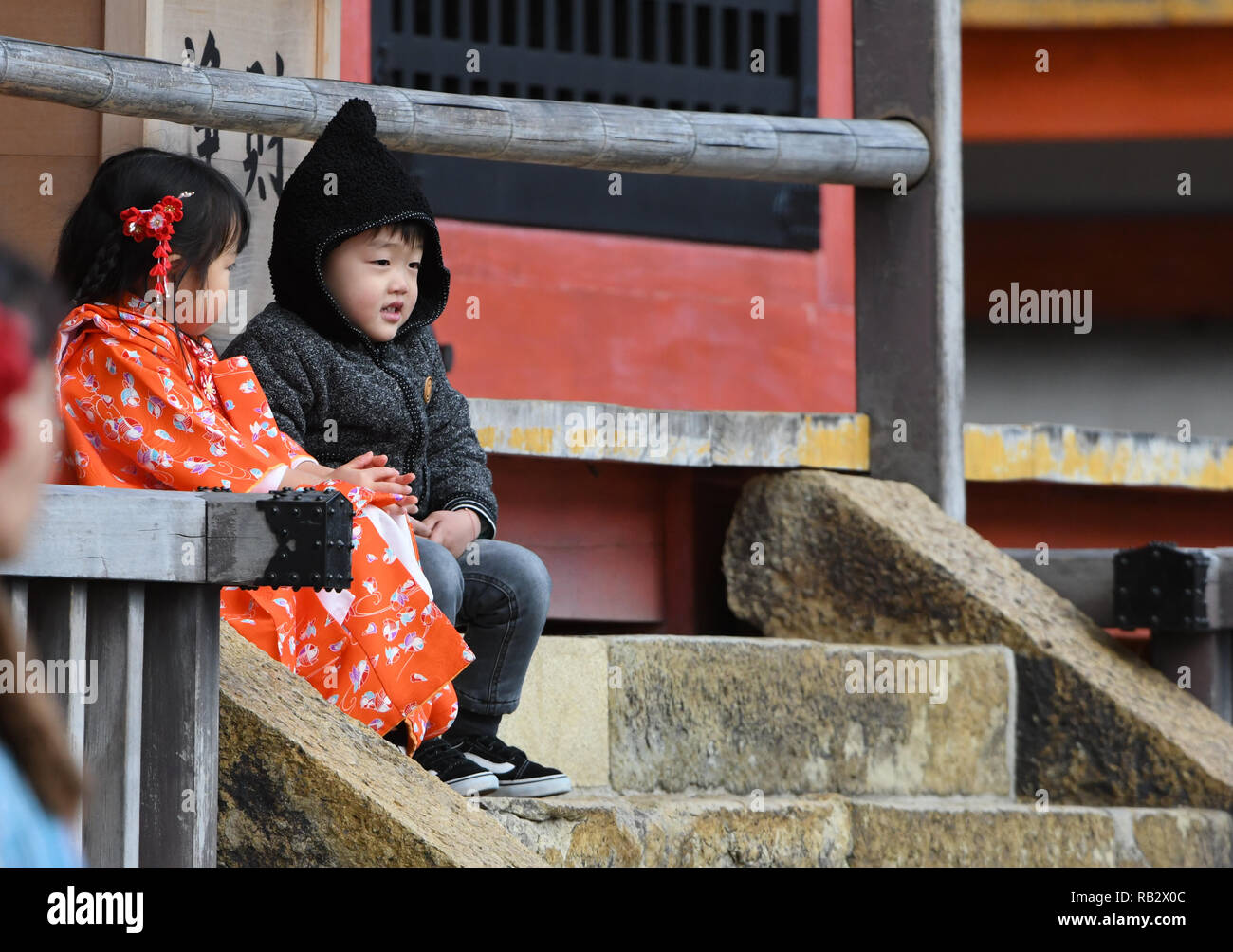 January 2, 2019 - Osaka, Japan - Riko Kasam of Osaka Japan sits on the stairs of one of the structures at the Iconic Buddhist temple Kiyomizu-dera on Mount Otowa known for the scenic views. On January 2, 2019.  Photo by: Ramiro Agustin Vargas Tabares (Credit Image: © Ramiro Agustin Vargas Tabares/ZUMA Wire) Stock Photo