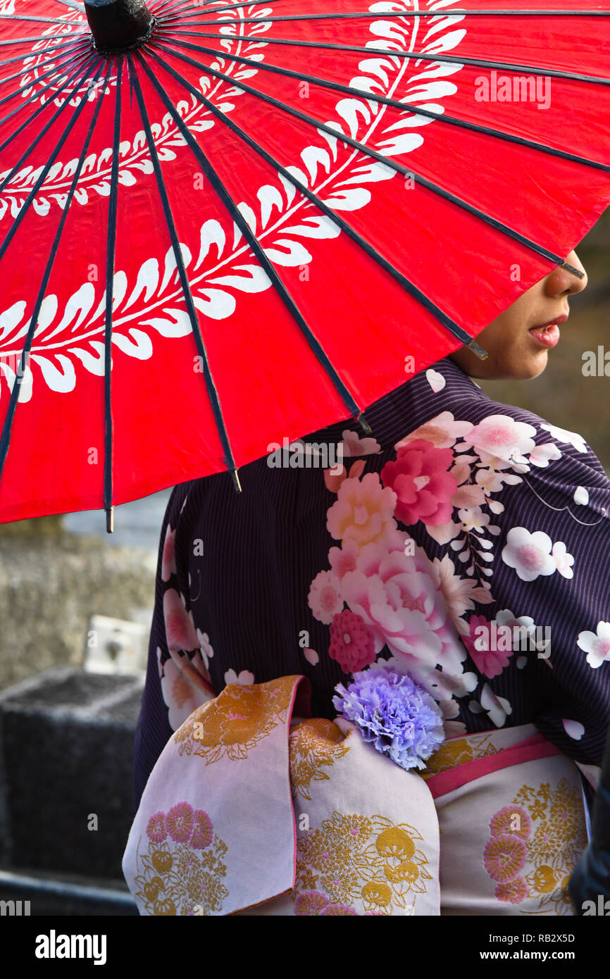 January 2, 2019 - Osaka, Japan - A girl holds an umbrella at the Iconic Buddhist temple Kiyomizu-dera on Mount Otowa known for the scenic views on Wednesday, January 2, 2019.  Photo by: Ramiro Agustin Vargas Tabares (Credit Image: © Ramiro Agustin Vargas Tabares/ZUMA Wire) Stock Photo