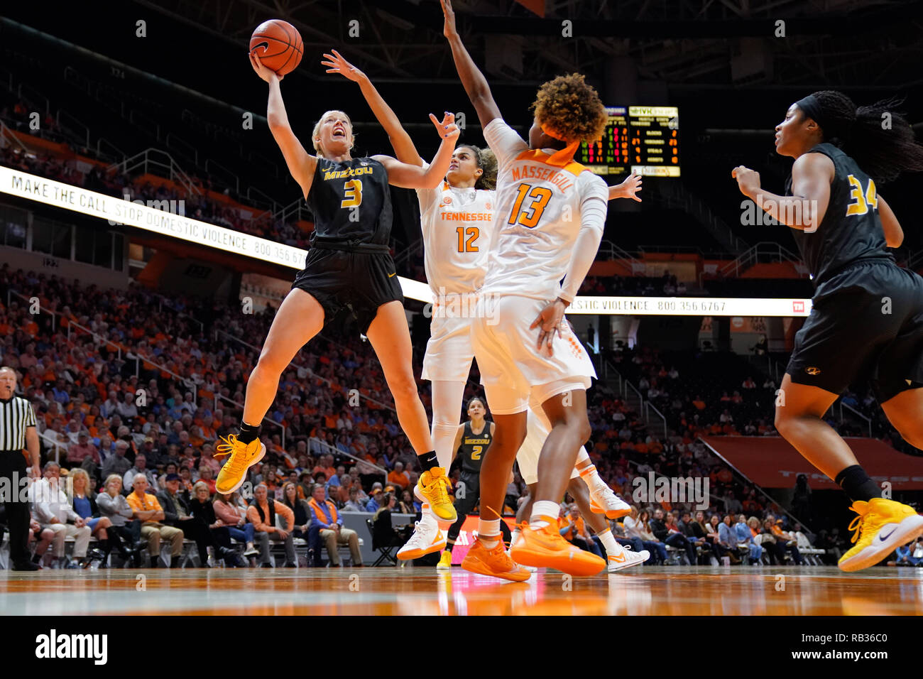 Knoxville, Tennessee, USA. 06th Jan, 2019. January 6, 2019: Sophie Cunningham #3 of the Missouri Tigers shoots the ball over Rae Burrell #12 and Jazmine Massengill #13 of the Tennessee Lady Volunteers during the NCAA basketball game between the University of Tennessee Lady Volunteers and the University of Missouri Tigers at Thompson Boling Arena in Knoxville TN Tim Gangloff/CSM Credit: Cal Sport Media/Alamy Live News Stock Photo