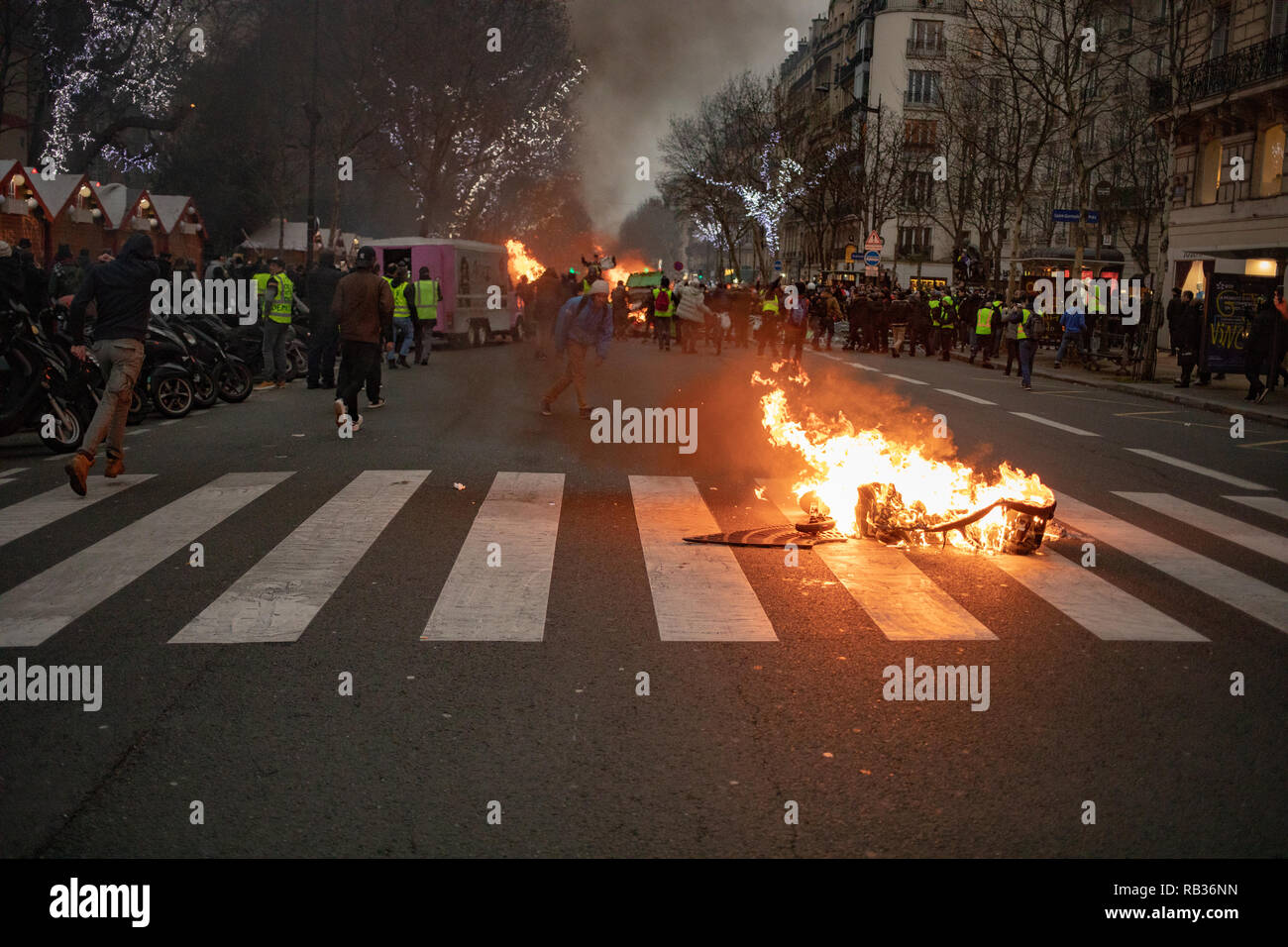 Thousands of protesters clashed with french authorities Saturday in Paris. that was the yellow vest movement's first action of 2019.  French President Emmanuel Macron is targeted for several weekends since october and is decision to raised fuel prices. Almost 50,000 people were protesting all over the country this Saturday. Stock Photo