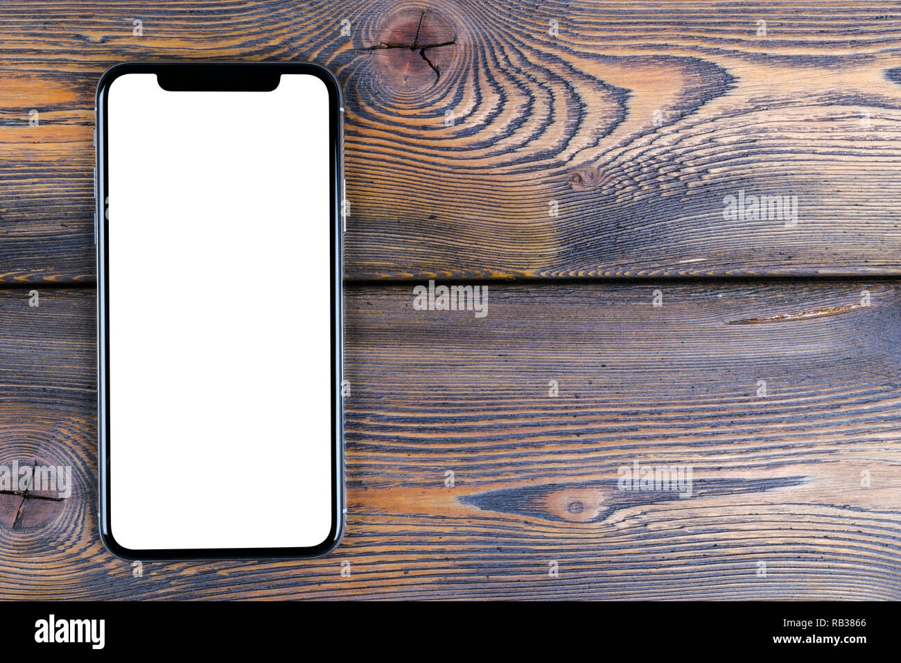 Frameless mockup smartphone with blank screen on office desk. Isolated ...