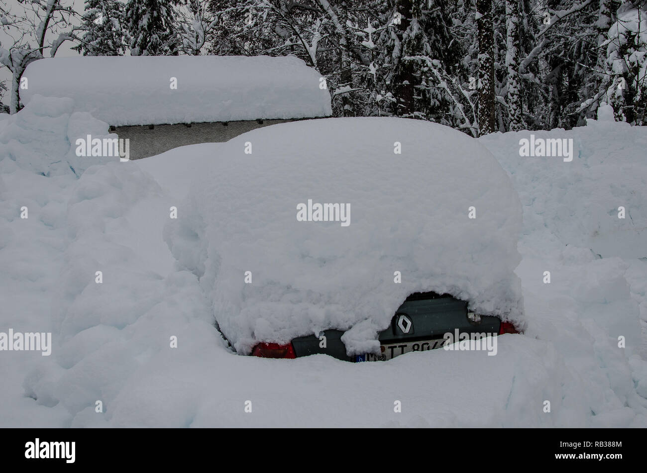 a car completely covered with snow Stock Photo